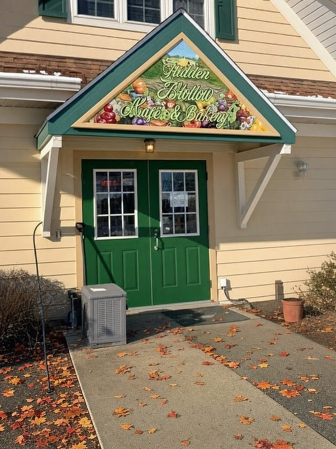 The café's green double-door entrance where pre-ordered lunches are picked up